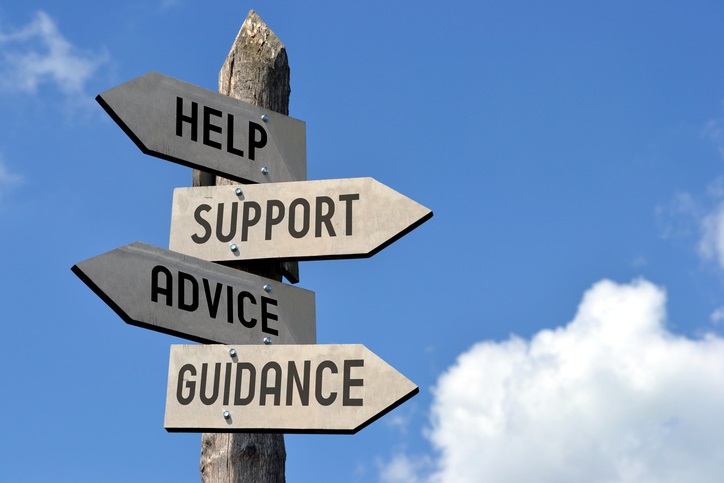 Photo displaying signs that offer help and guidance