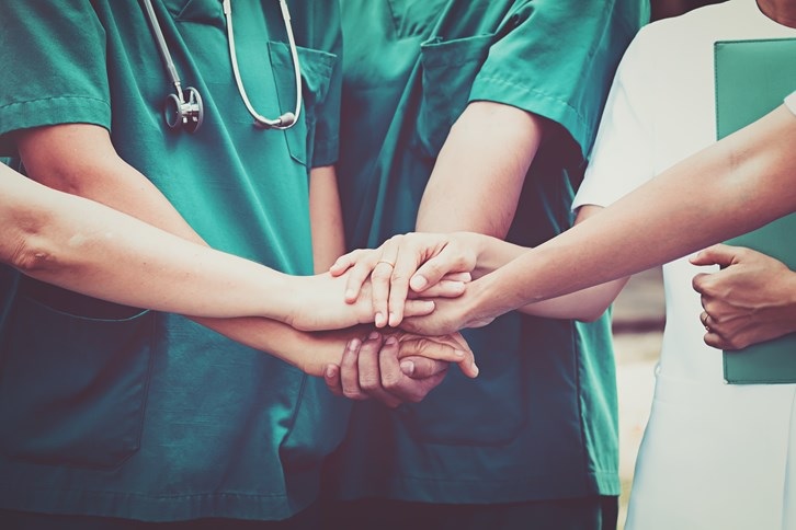 Photo of an engaged staff of healthcare workers at a hospital