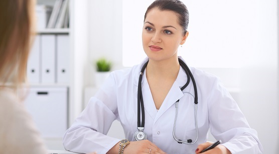 Photo of a doctor looking engaged in a conversation